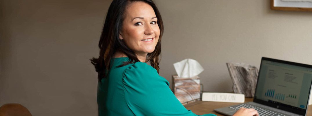Jessica Champion working in LivePlan at her desk